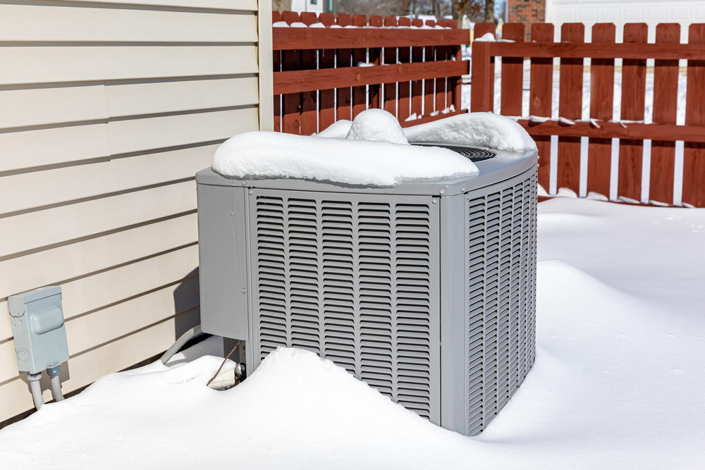 House,air,conditioning,unit,covered,in,snow,during,winter..,concept